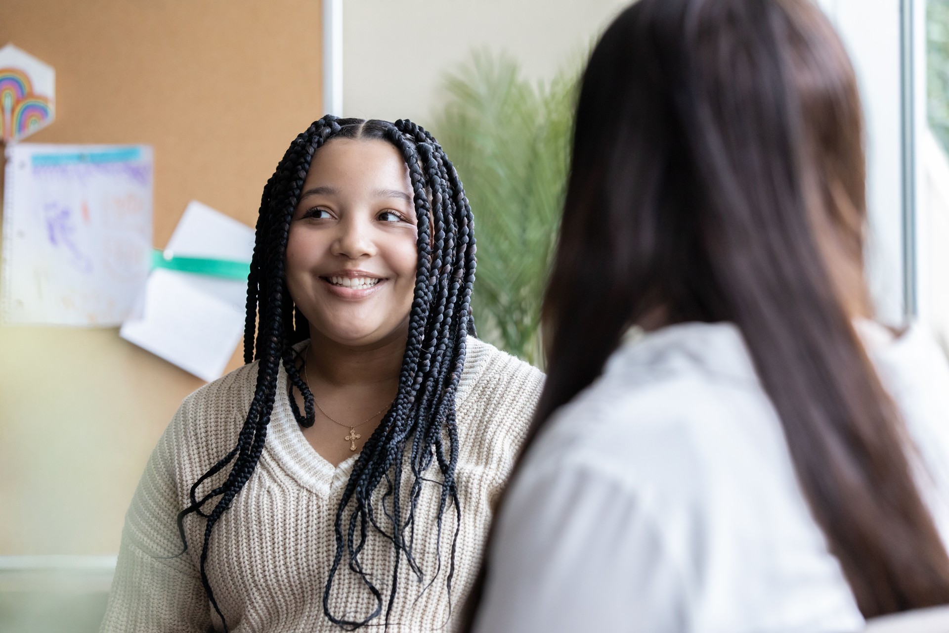 Middle school girl meets with counselor or teacher during conference